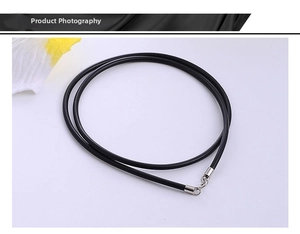 Detail of black rubber necklace cord with silver metal plug-in cylindrical clasp closure