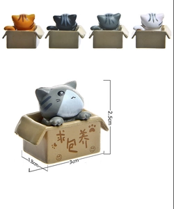 Detailed view of 3D plastic cartoon cat figurines in boxes with size measurements