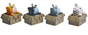 Detail of four cute 3D cartoon cats in boxes with metal keyrings for couples