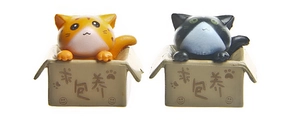 Detail of 3D plastic cat figurines in miniature boxes with Please Adopt Me text