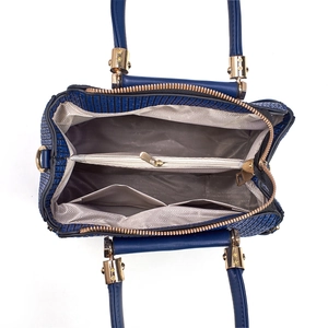 Detailed interior of dark blue textured tote showing compartments and golden hardware