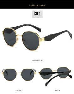 Detail view of gold octagonal metal sunglasses with dark lenses and black temple tips