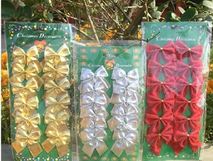 Detailed close-up of 12pcs colorful Christmas bows in gold silver red on a backing card