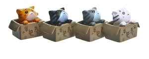 Detail view of 4 cute 3D cartoon cats sitting in boxes with paw print designs