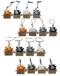 Detailed set of 3D cartoon cat keychains in orange, black, and white PVC styles