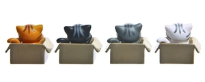 Detailed view of four 3D plastic cartoon kittens in boxes showing cute back profiles