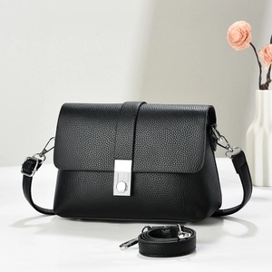 Chic black litchi grain shoulder bag with silver buckle and adjustable strap