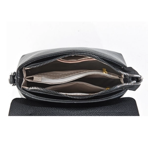 Interior view of black pebble leather crossbody bag with dual zipper pockets and lining