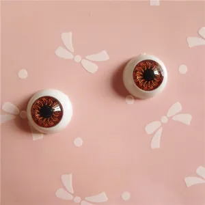 Macro view of 12mm BJD doll eyes with brown iris and realistic radial texture detail