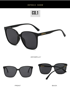 Detail view of vintage square sunglasses with red and yellow stripe accents on temples