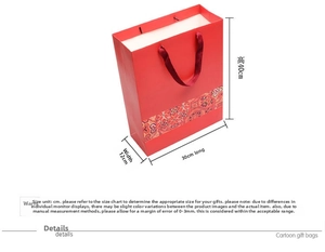 Detail view of red gift bag with 40x30x12cm dimensions and durable ribbon handles