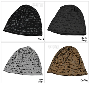 Detail view of thin knit beanies in black and grey with all-over script print