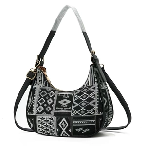 Black and white geometric jacquard hobo shoulder bag with black leather straps