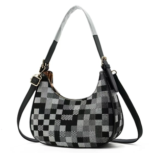 Minimalist checkerboard canvas underarm bag with black leather trim and gold hardware