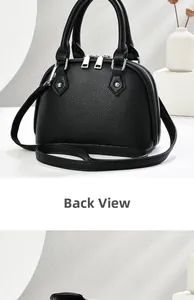 Rear view of black shell bag showing premium pebble leather texture and silver hardware