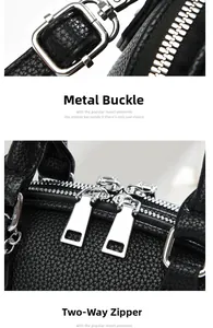 Detail of silver buckles and smooth dual zippers on black pebble leather tote bag