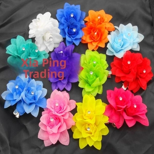 Close-up of vibrant multi-color silk flower hair clips with sparkling center rhinestones
