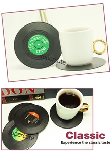 Close-up of vintage vinyl record coasters with colorful labels and non-slip texture
