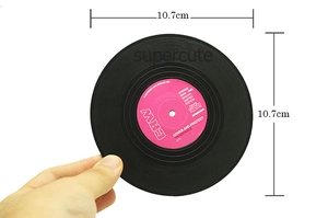 Detailed view of creative vinyl record coaster with 10.7cm diameter and pink label