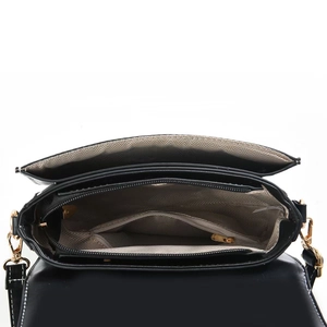 Detail view of multi-layered interior structure and fabric lining of black leather bag
