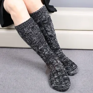 Thick cable knit knee-high Christmas socks in grey marl for winter home warmth