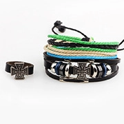 Detailed view of multilayer woven leather bracelet set with metallic cross charms and ring