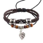Detailed view of multilayer braided leather bracelets with wooden beads and leaf charms