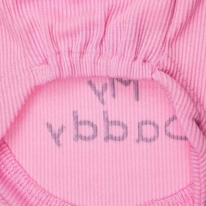 Macro detail of pink ribbed knit pet vest fabric with durable neckline stitching