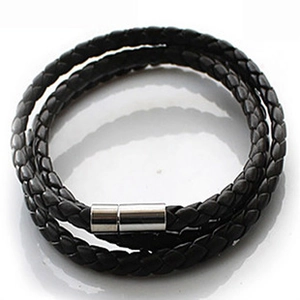 Detail of multi-layer braided black leather bracelet with silver magnetic metal clasp
