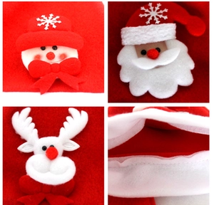 Detail view of red felt Christmas decorations with snowman, Santa, and reindeer patterns