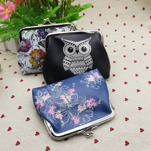 Detailed close-up of retro PU leather coin purses with vintage floral and owl patterns