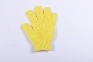 Macro detail of the yellow nylon exfoliating bath glove with textured scrubbing surface