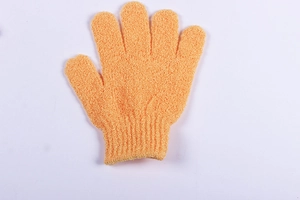 Detailed close-up of orange exfoliating shower glove with elastic wrist and rough texture