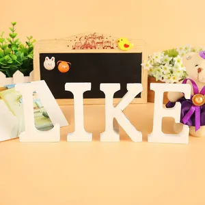 Detailed close-up of white wooden LIKE letters for home wedding decor and photography
