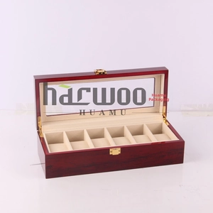 Detail view of 6-slot wooden watch box with mahogany lacquer and glass window