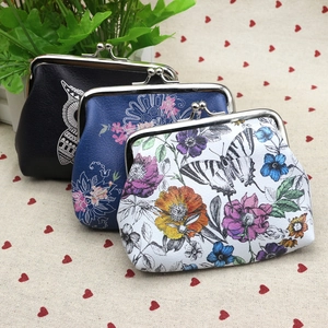 Macro shot of PU leather coin purses with owl and mandala patterns and metal clasps