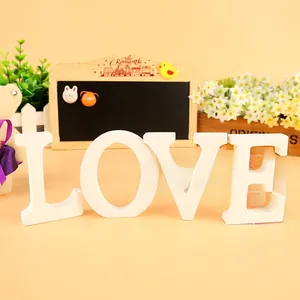 Close-up of white wooden LOVE letters for wedding decor and photography props