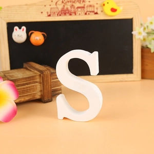 Close-up of a free-standing white wooden capital letter S for wedding and home decor