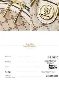 Detailed macro view of beige fabric texture with gold hardware on a round crossbody bag