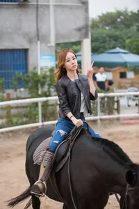 Close-up of black leather jacket sleeve with functional zipper detail on high-quality fabric