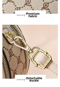 Detail of vintage monogram pattern leather and detachable gold metal hardware buckle