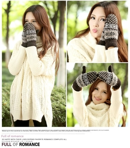 Detail of warm double-layered knit mittens with Nordic snowflake patterns in dark coffee brown