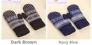 Detail of knitted mittens featuring winter snowflake patterns in dark coffee and navy blue