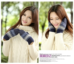 Detailed knit of warm Fair Isle pattern mittens with thick wool fabric for winter outdoors