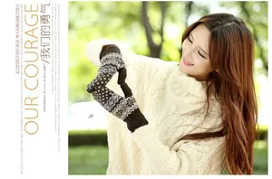 Detail of vintage jacquard knit gloves with snowflake pattern and warm wool material