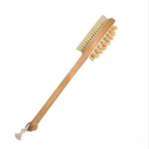Close-up of double-sided wooden bath brush with natural bristles and massage nodes