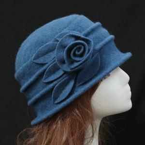 Elegant navy blue wool cloche hat for women with handcrafted floral detail in side view