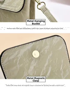 Detail of gold-plated hardware and magnetic closure on marble texture handbag