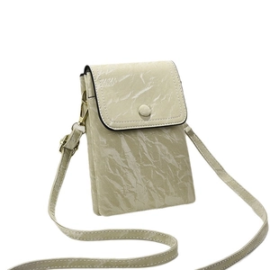 Mini mint green crossbody phone bag with marble texture and adjustable shoulder strap