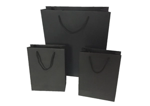 Three sizes of premium matte black paper gift bags with durable cotton rope handles